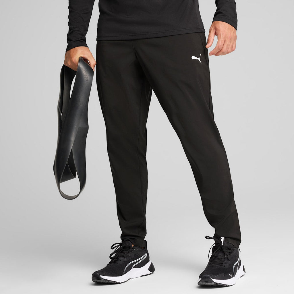 TAD ESSENTIALS Woven Tapered Pants Men - PUMA Black model image
