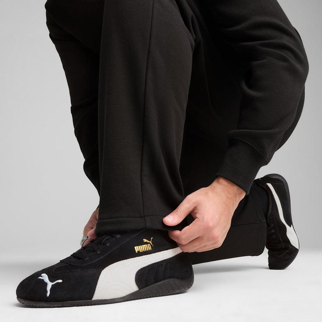 WARDROBE Essentials Relaxed Sweatpants Men - PUMA Black - model-side