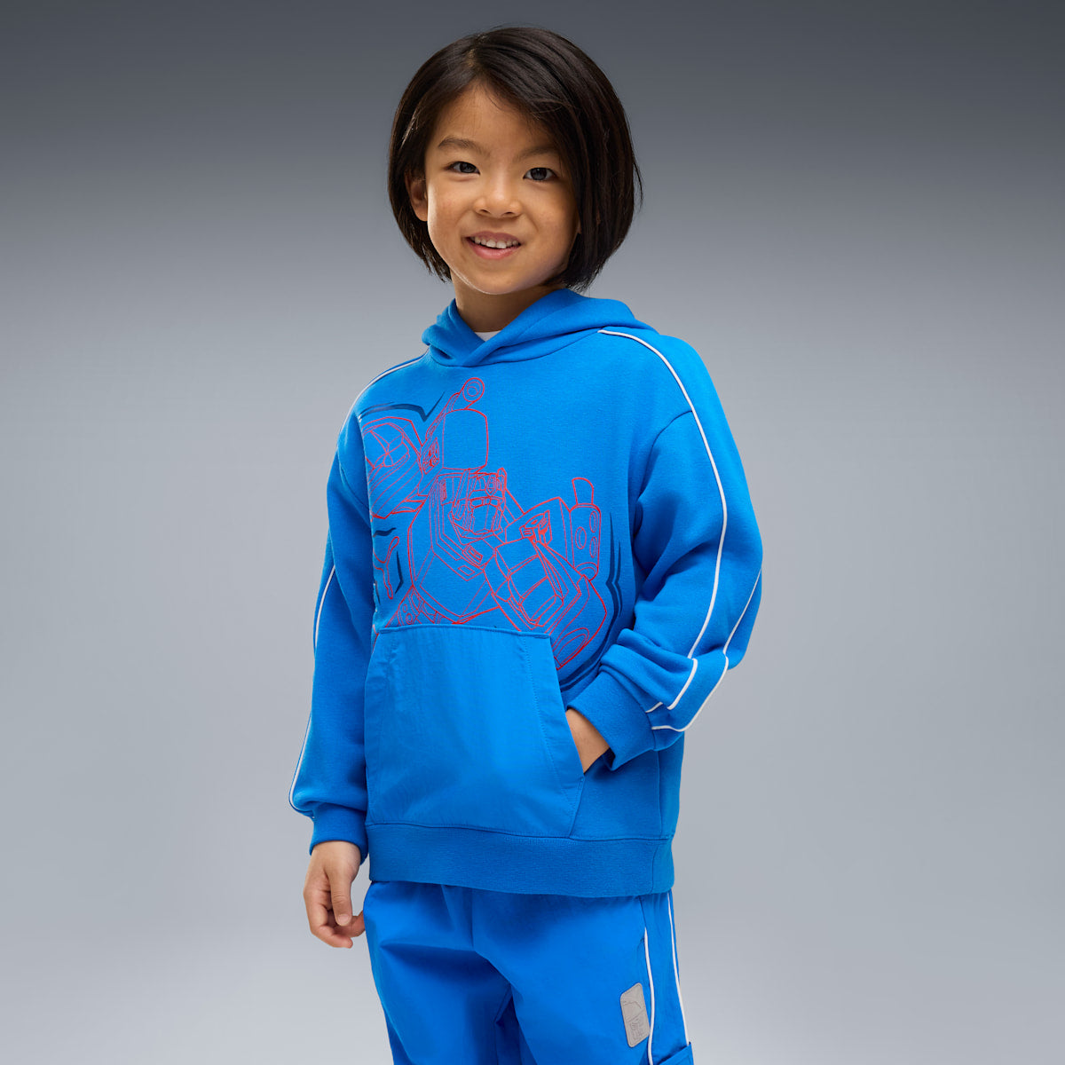 PUMA x TRANSFORMERS T7 Relaxed Graphic Hoodie Kids - Racing Blue - on model