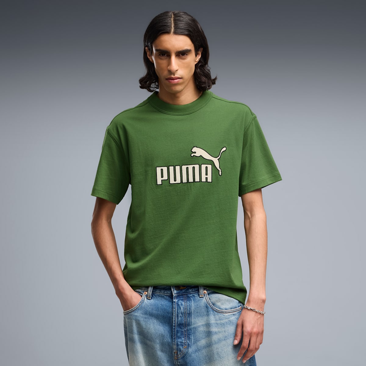 PUMA Elevated Essentials Men's Relaxed Tee - Earthy Green - on model