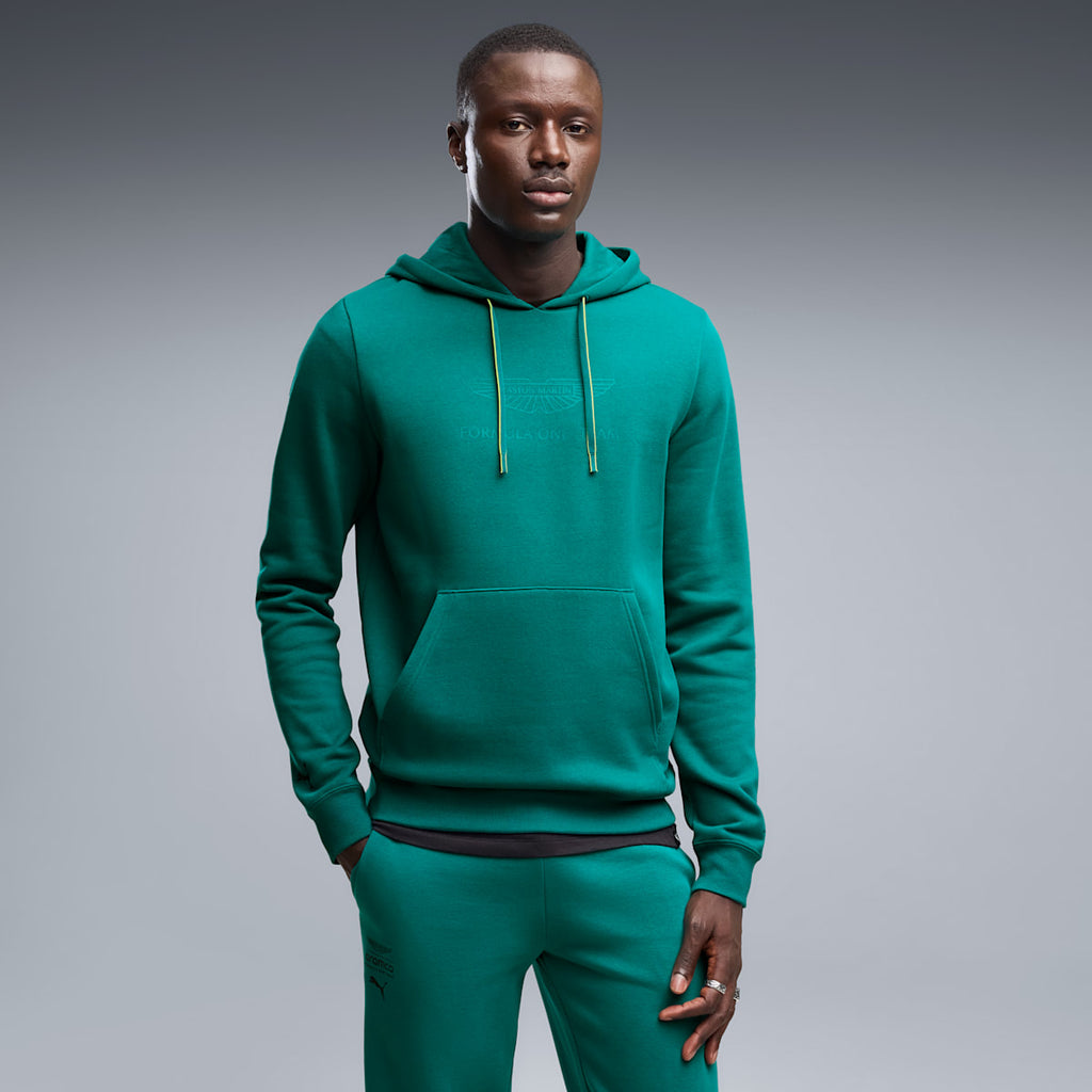 PUMA x ASTON MARTIN ARAMCO F1® TEAM Essentials Hoodie Men - Green Lux - on model