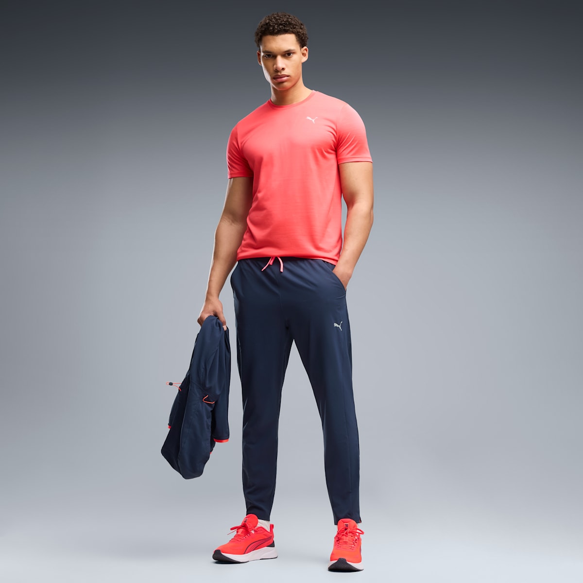 PWRTRAIN Stretch Woven Pants Men - PUMA Navy - on model