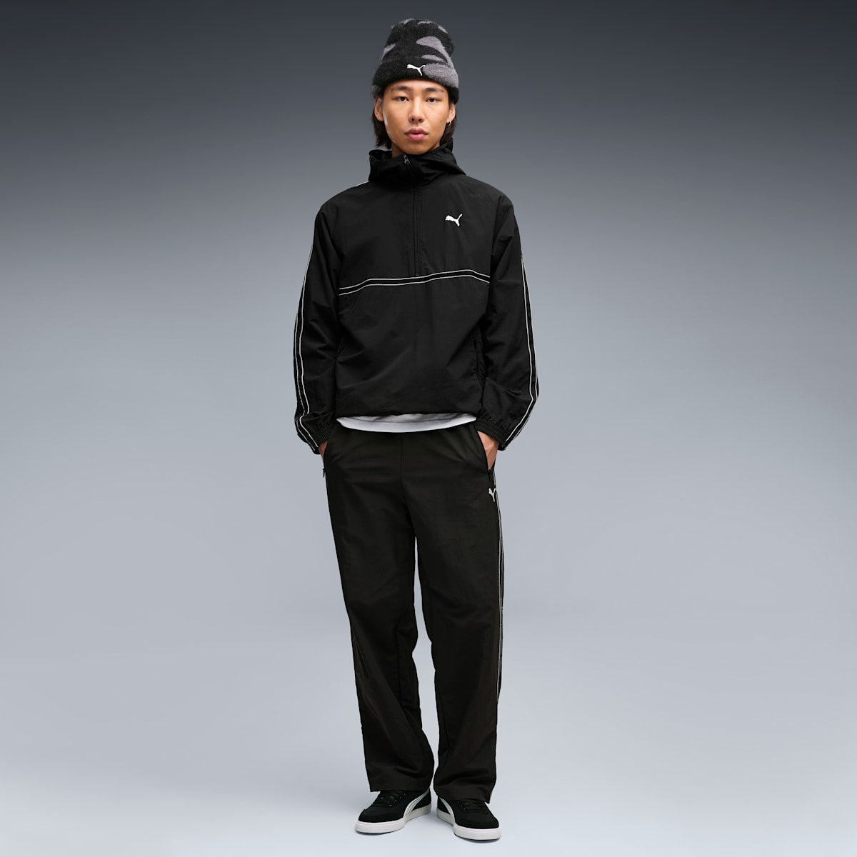 PUMA Class Men's Relaxed Pinnacle Woven Track Pants - PUMA Black - on model